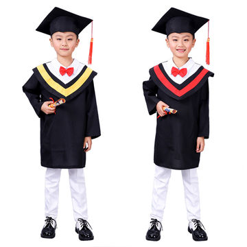 Portrait Of Two Children In A Graduation Gown. Education. Isolated Over  White. Stock Photo, Picture and Royalty Free Image. Image 13291862.