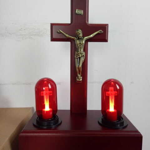 red crucifix light bulb