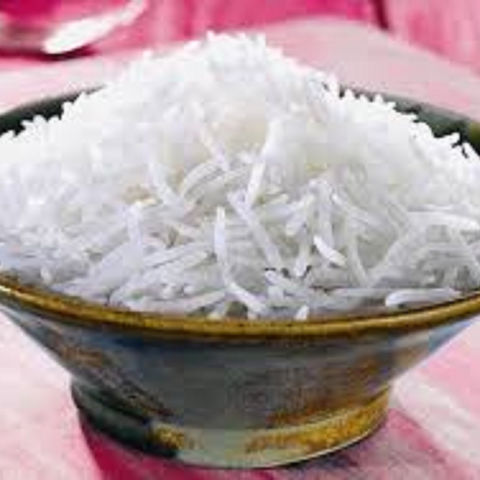 Nasi Kuning dengan Lauk Pelengkap di Meja Makan