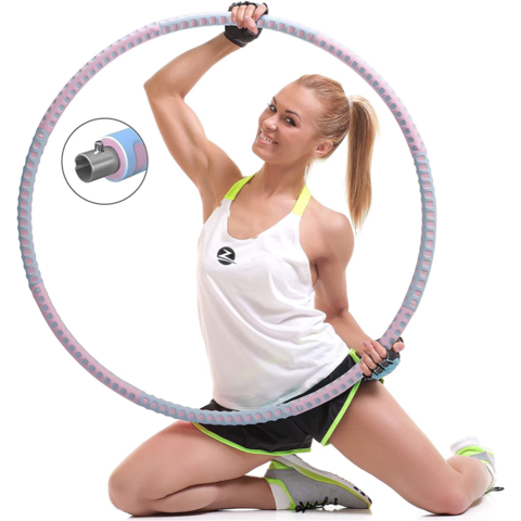 Niña deportiva haciendo ejercicios con un hula hoop foto de alta calidad