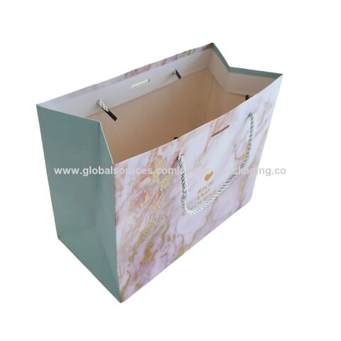 Sac de shopping en papier bleu de luxe avec logo de marque personnalisé pour l'emballage de vêtements, sac cadeau