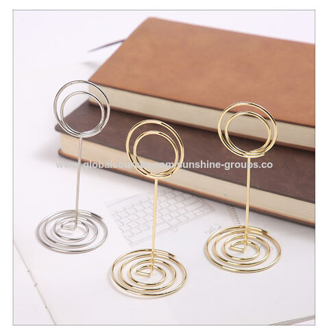 Soporte para tarjetas de visita de metal electrochapado simple y moderno, diseño de ojo de pavo real, tarjetero vertical para escritorio de oficina for sale at factory direct price
