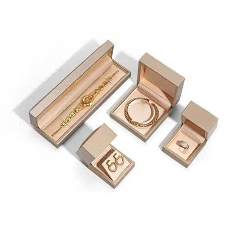 Cajas personalizadas para embalaje de joyas en oro champán para pulseras y pendientes de aro - Productos personalizados