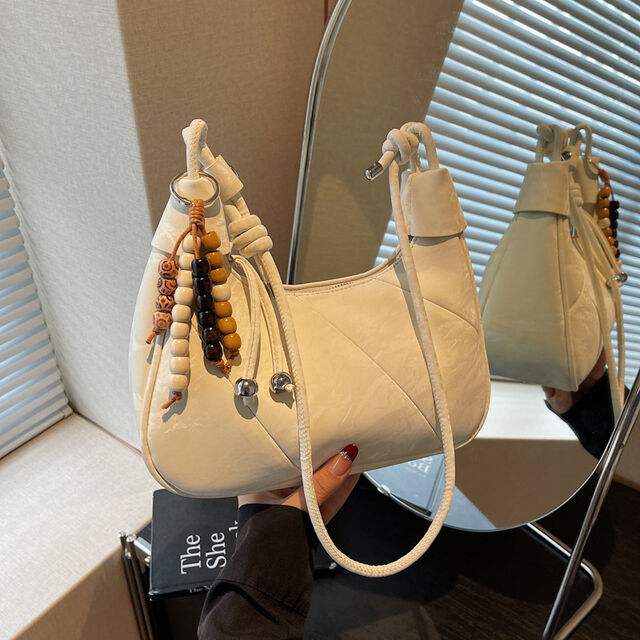 Casual and simple dumpling-shaped women's personalized and fashionable shoulder bag for daily use, with a crossbody design