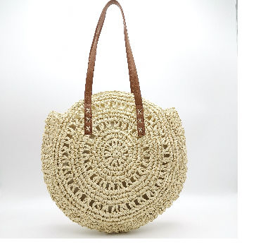 Bolso redondo best sale de paja