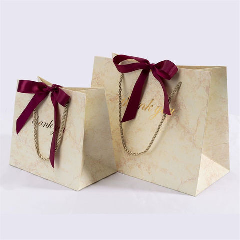Quels types de sacs papier choisir pour offrir un cadeau ? - Comptoir de  l'emballage