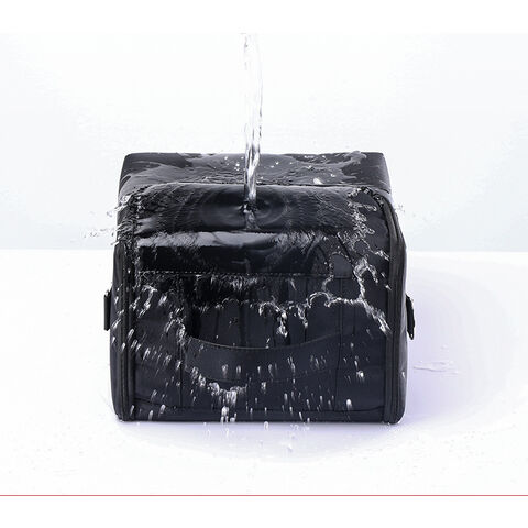 Bolso grande de tela y nylon impermeable con cremallera, negro con hojas  verdes.