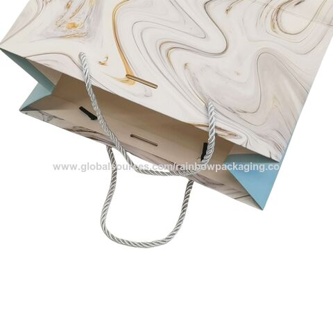 Sac de shopping en papier bleu de luxe avec logo de marque personnalisé pour l'emballage de vêtements, sac cadeau