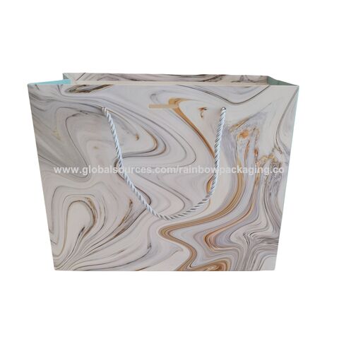 Sac de shopping en papier bleu de luxe avec logo de marque personnalisé pour l'emballage de vêtements, sac cadeau