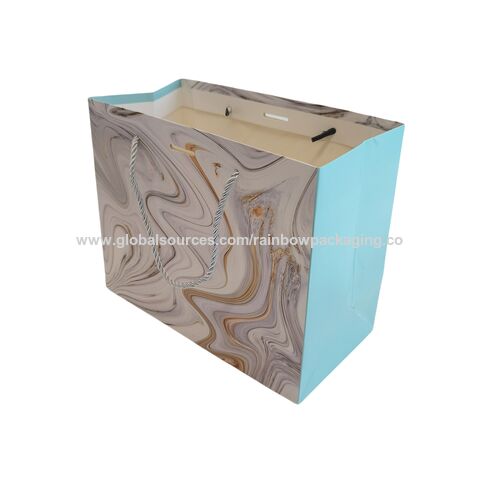Sac de shopping en papier bleu de luxe avec logo de marque personnalisé pour l'emballage de vêtements, sac cadeau