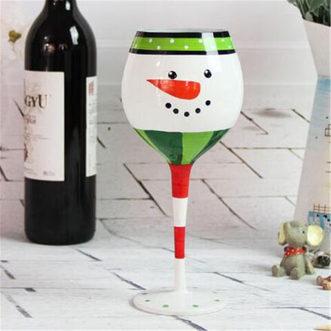 Glasbecher mit Weihnachtshaus- und Hirschmotiv