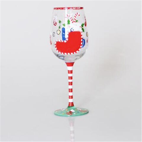 Glasbecher mit Weihnachtshaus- und Hirschmotiv