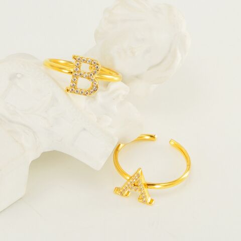 Anillos de acero inoxidable al por mayor para mujer con circonita AAA, 26 letras inglesas, apertura ajustable, joyería de moda, precio de fábrica