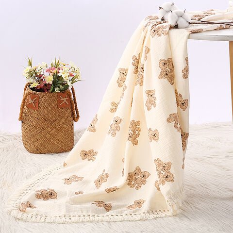 Couverture pour enfants en gros, double épaisseur, pliante, couverture d'emmaillotage en pur coton doux avec pompons, couverture de poussette pour bébé, pour la maison