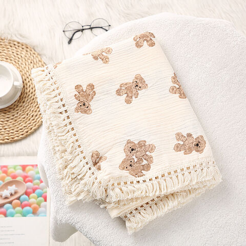 Couverture pour enfants en gros, double épaisseur, pliante, couverture d'emmaillotage en pur coton doux avec pompons, couverture de poussette pour bébé, pour la maison
