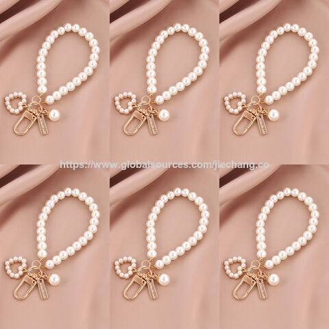Llavero con colgante de pulsera de amor creativo 2025, accesorios de perlas al por mayor