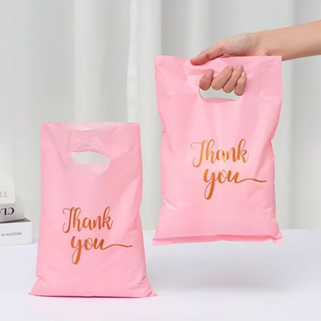 Tas Terima Kasih Barang Bermerek Ritel Kustom Profesional Tas Belanja Tote Plastik PE Merah Muda untuk Butik Hadiah Belanja Ritel