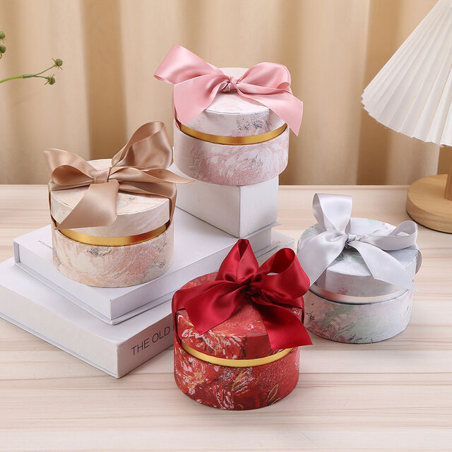 Zylindrische Geschenkverpackungen aus luxuriösem, bedrucktem Karton mit individuellem Band von ACME Packaging