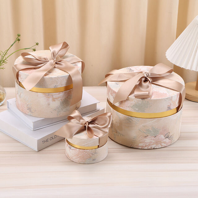 Zylindrische Geschenkverpackungen aus luxuriösem, bedrucktem Karton mit individuellem Band von ACME Packaging