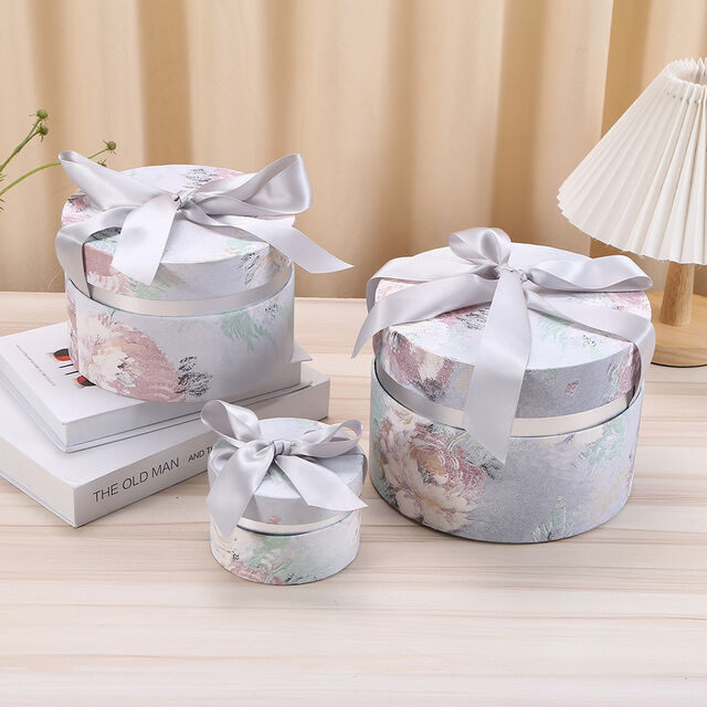 Zylindrische Geschenkverpackungen aus luxuriösem, bedrucktem Karton mit individuellem Band von ACME Packaging