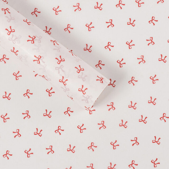 El papel de regalo tiene un tacto lujoso. El material de embalaje está adornado con lazos y hecho de papel Snow Pear.