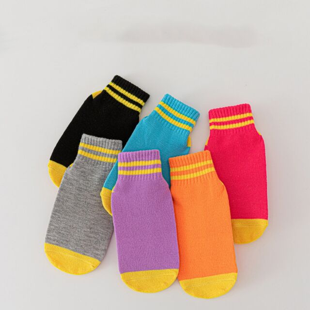 Vente en gros de chaussettes antidérapantes pour enfants, chaussettes pour aire de jeux, mi-mollet, double barre, blocs de couleur, trampoline, personnalisables