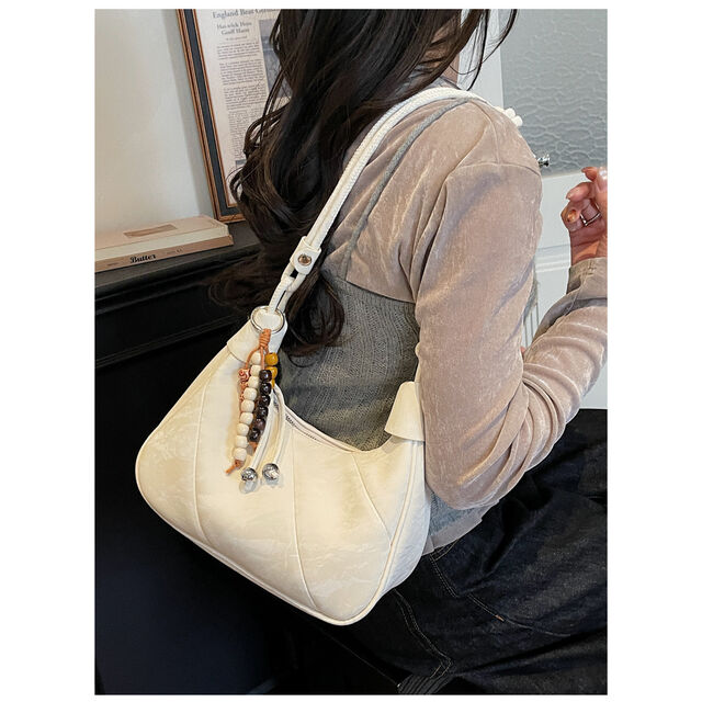 Casual and simple dumpling-shaped women's personalized and fashionable shoulder bag for daily use, with a crossbody design
