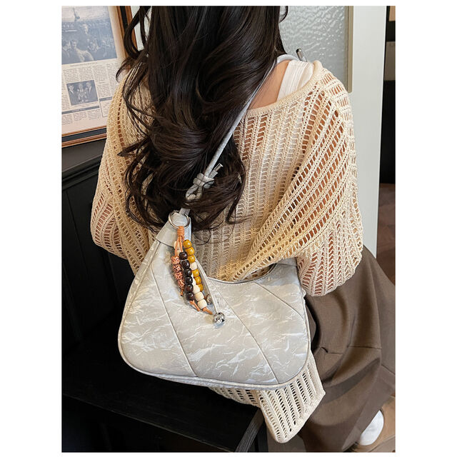 Casual and simple dumpling-shaped women's personalized and fashionable shoulder bag for daily use, with a crossbody design