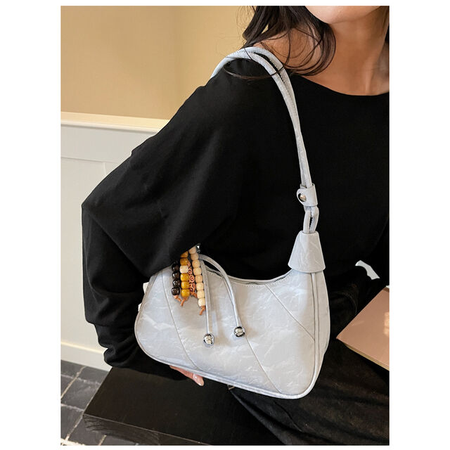 Casual and simple dumpling-shaped women's personalized and fashionable shoulder bag for daily use, with a crossbody design