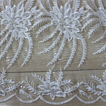 white beaded lace fabric