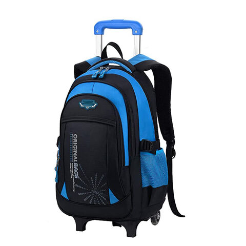 boy rolling book bag