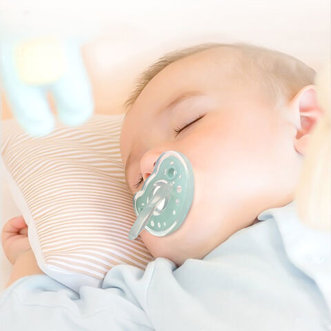 baby sleeping with pacifier