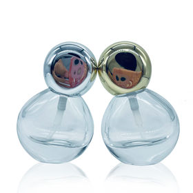 Pair of Large Spherical Clear Glass Bottles