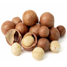 New crop hazelnuts in ceramic bowl with nut crusher on the wooden