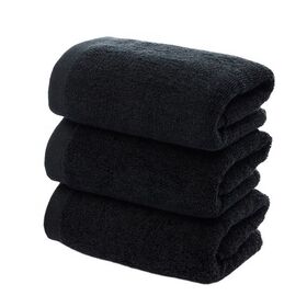 What advantages do bleach-resistant towels have in a salon setting?