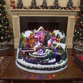 Casas de Pueblo Navideño - Edificios Coleccionables con Tren en Movimiento, Familia y Muñeco de Nieve, Adornos Musicales con Luz Cálida para Decoración Navideña