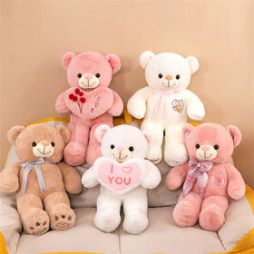 Boneka beruang teddy memeluk hati yang lucu - boneka beruang teddy lucu sebagai hadiah pernyataan Hari Valentine, hadiah ulang tahun.