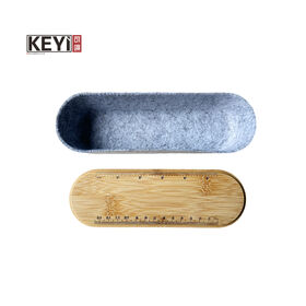 Felt pen holder with bamboo cover and elastic band. With ruler and integration