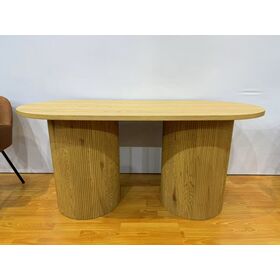 Natural wood grain double-column dining table with vertically grained round legs and an oval tabletop. A warm and inviting home di
