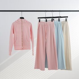 Zweiteiliger Trainingsanzug für Damen: Figurbetonter Kapuzenpullover mit durchgehendem Reißverschluss und weit geschnittenen Yogahosen. Yoga-Hoodies mit Kordelzug und weit geschnittenen Hosen.