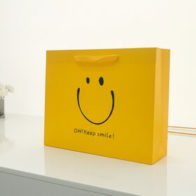Customized Logo Cardboard Paper Gift Bag Happy Face Yellow Paper Bag for Cosmetics Clothing Shoes Gifts